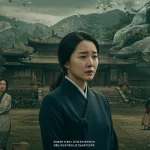 Go Ae-sin, a strong female character from Mr. Sunshine, stands in a poignant historical setting, embodying her lasting legacy.